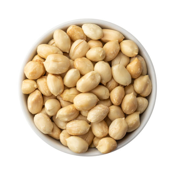 istock Peeled peanuts in a bowl isolated over white background 1335312613