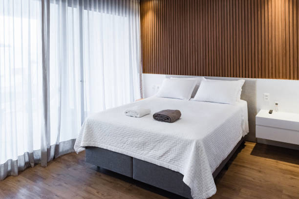 istock Double bed in a large bedroom 1335315908
