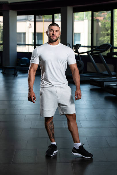 istock Handsome Man Posing In White T-shirt 1335316560