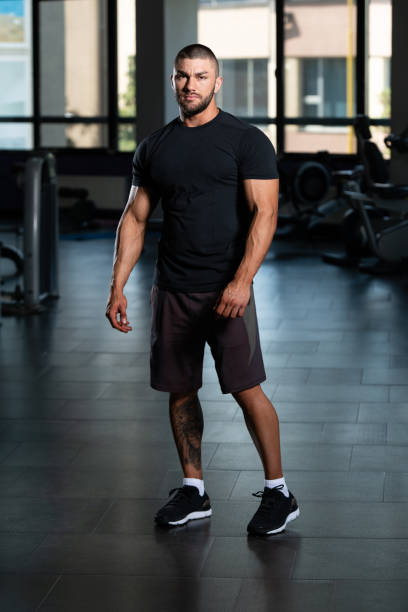 istock Muscular Man Posing In Black T-shirt 1335316567