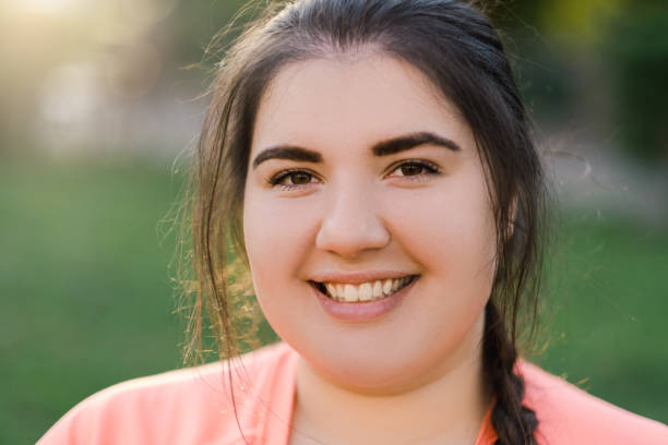 istock smiling woman overweight people happy plus size 1335316626