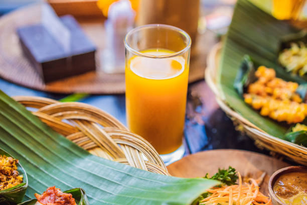 istock Jamu. Traditional medicine and herbal drink in Indonesia, most prevalent in Java. Made from natural materials, such as parts of plants such as roots, bark, flowers, seeds, leaves and fruits 1335317315