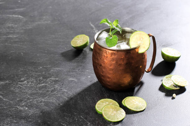 istock Icy Cold Moscow Mules with Ginger Beer, Lime,  and Vodka, Garnish with Mint Leaf 1335318158