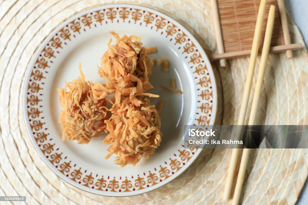 Udang Rambutan, Crispy DImsum with Shrimp Coating with Noodle, Depp Fried, Served with Sauce Color Image Stock Photo