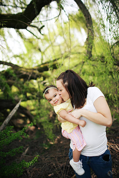 istock mother kissing baby 133532314