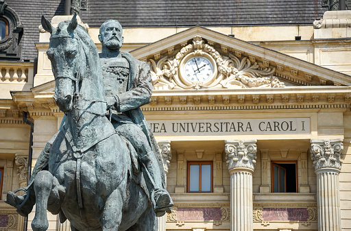 Bucharest, Romania - August 12, 2021: The statue of King Carol I of Romania in front of the Central University Library \