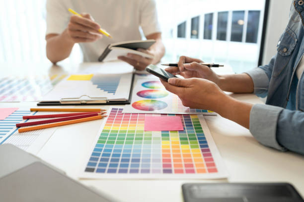 istock two designers discussing on the color tone for the excellent visual work. 1335338522