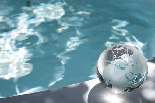 glass globe and shining water surface