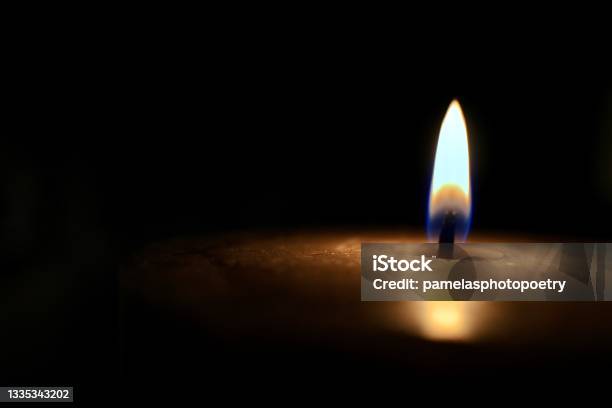 Isolated Glowing Candle On Black Background Stock Photo Stock Photo - Download Image Now
