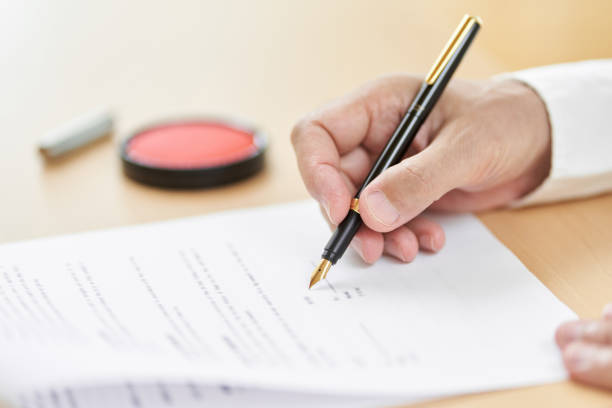 istock Elderly people signing contracts 1335345481