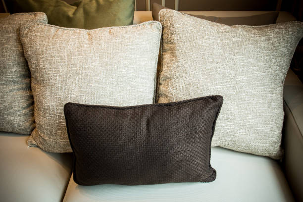 istock Stylish bedroom with black pillow on the bed. 1335345527