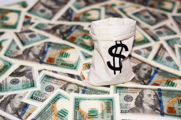 istock Jute sack with dollar sign 1335350879