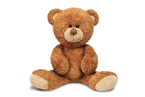 Little cute caucasian girl hugs her favorite toy big teddy bear. Love and tenderness. Happy childhood concept. Gift for a birthday or other holiday