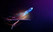 Futuristic Conceptual Photo. Startup Concept. Rocket Take-off  and Released from Digital Tablet to Space