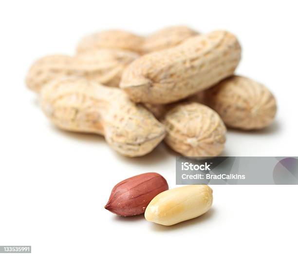 Peanuts Focused In White Background Stock Photo - Download Image Now - Allergy, Food Allergy, Horizontal