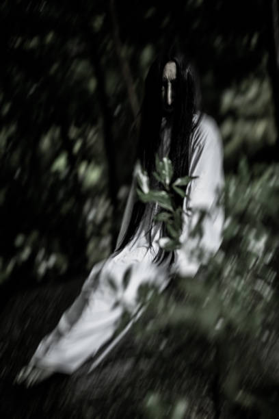 istock Scary female Japanese ghost in a forest 1335360008