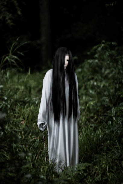 istock Scary female Japanese ghost in a forest 1335360009