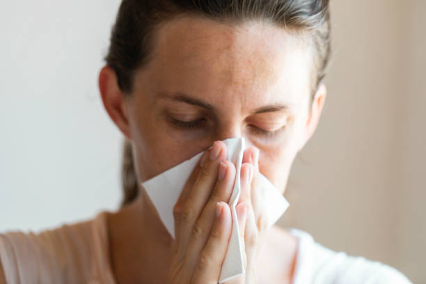 istock Women Cleaning Her Nose 1335361464