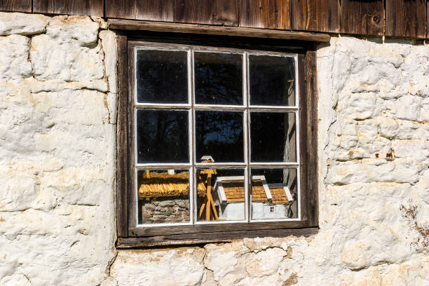 Falköping, Sweden - May 14, 2016: Windows on an old cottage model built houses