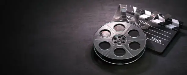 Film reel and clapper board on black background. Movie, video and cinema prodaction and edition concept. 3d illustration