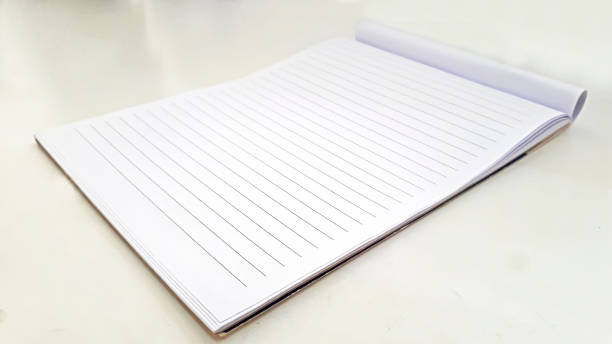 istock a blank white book that sits on a white desk in an office and this book is used for writing 1335366684