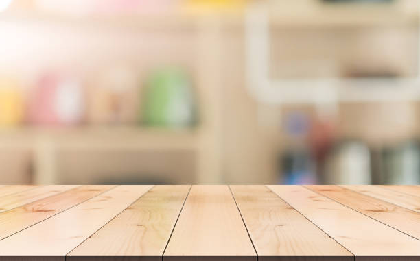 istock Empty wooden table top with lights bokeh on blur restaurant background 1335367630