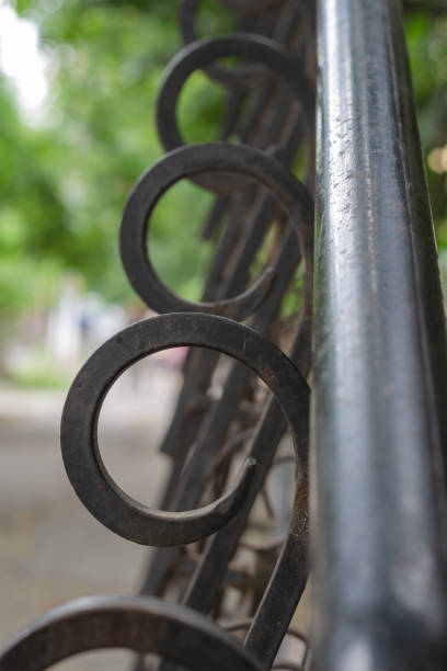 istock Defocused shot of black metal railing with decorative elements. 1335368954