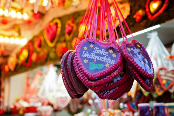 Market stall at the Christmas market and gingerbread hearts stock photo