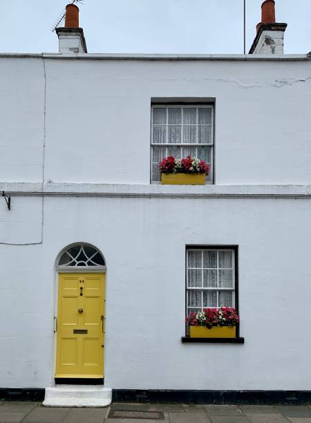 istock White medieval house with yellow arched door 1335369864