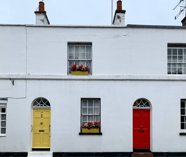 istock White house with yellow and red arched doors 1335369918
