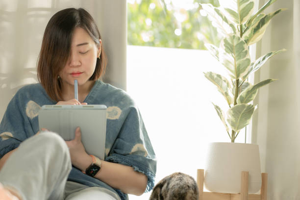 istock Asian Woman Use Tablet Meeting And Working From Home 1335371436