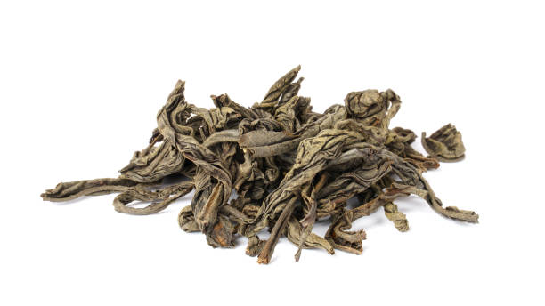 istock loose tea isolated on white. dried tea leaves 1335374322