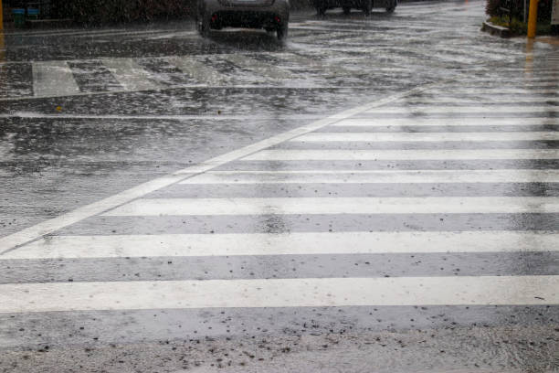 istock Crosswalk at an intersection in heavy rain 1335375581
