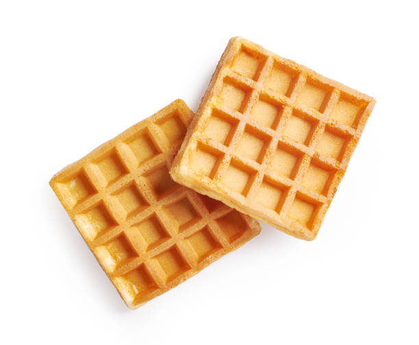 istock Two waffles isolated on white background. Top view of waffle. 1335375816