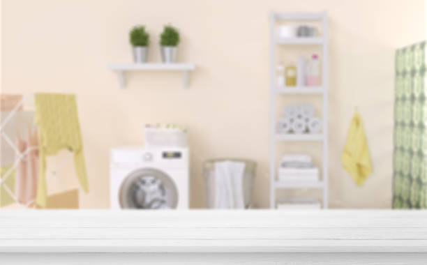 istock Empty wooden table in laundry blue room. Mockup for your design. 1335377021