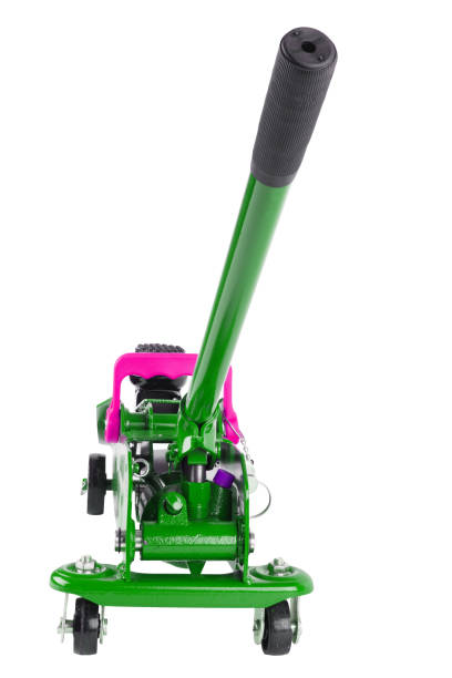 istock green hydraulic car jack isolated on white background, lowered 1335380915