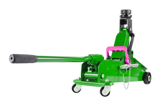 istock green hydraulic car jack isolated on white background, rised up 1335380923