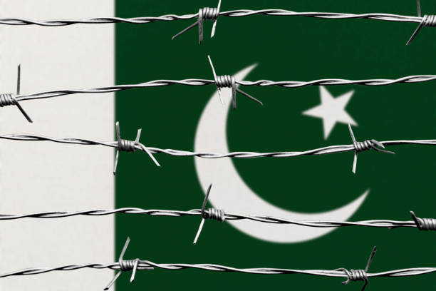Pakistani Flag and razor wire. Immigration concept. Border security.