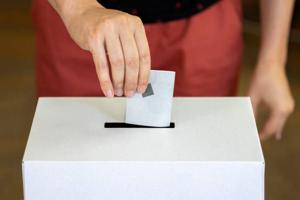 istock Person casts his vote 1335381294