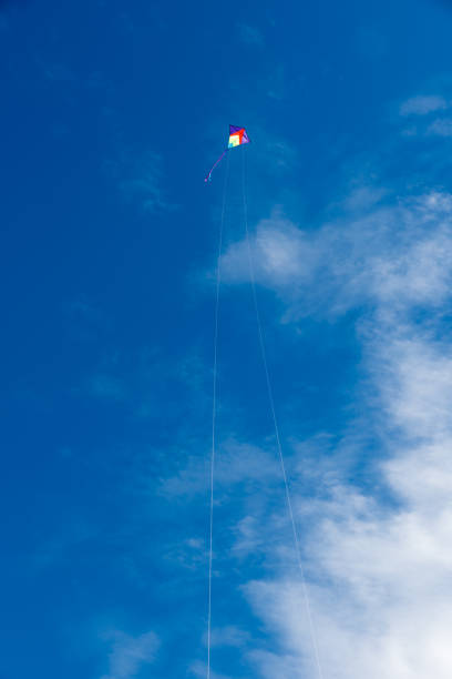 istock Colorful Kites flying over the sky 1335390672