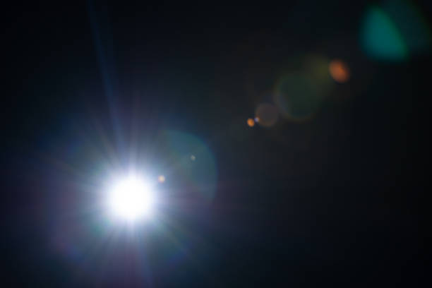 istock Sun flare on the black background 1335392697