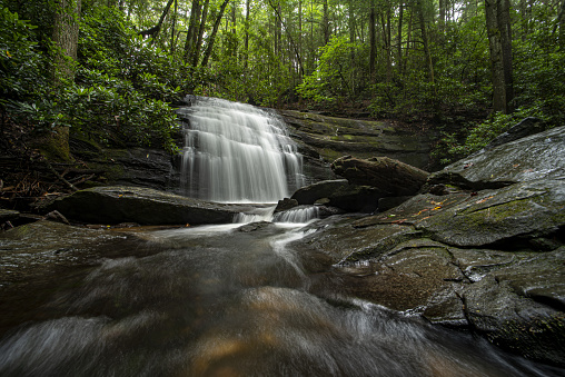 Long Creek Falls in Chattahoochee National Forest, with water flowing towards us, over boulders and just under the camera. Photo taken in Chattahoochee National Forest, near the town of Ellijay, Georgia. Nikon D750 with Venus Laowa 15mm macro lens.