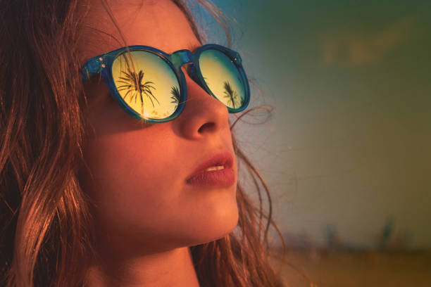 istock Brunette girl sunglasses with palm tree 1335396928