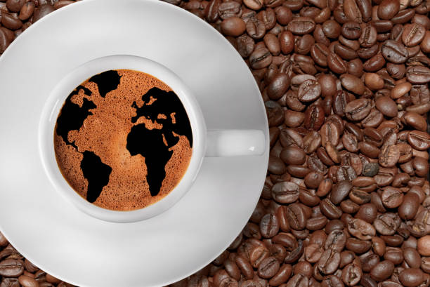 istock Cup of coffee with world map in cream 1335399894