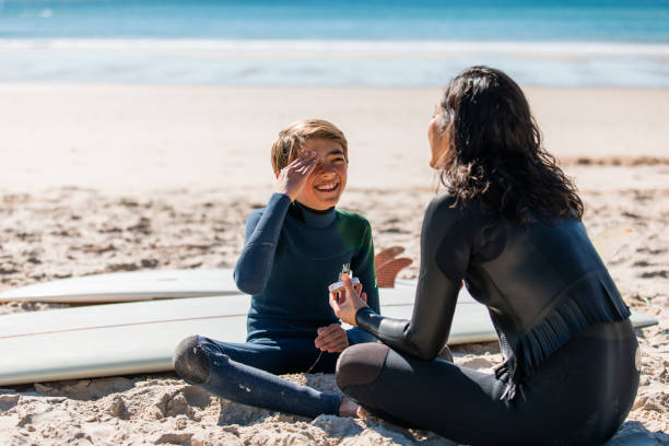 istock Aussie mums helps her son apply natural sunscreen 1335399949