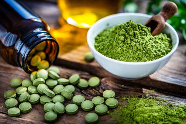 istock Dietary supplement: Moringa oleifera powder and pills 1335399969