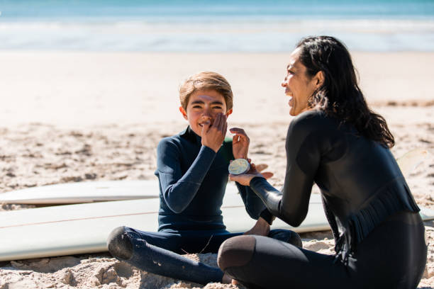 istock Aussie mums helps her son apply natural sunscreen 1335399983