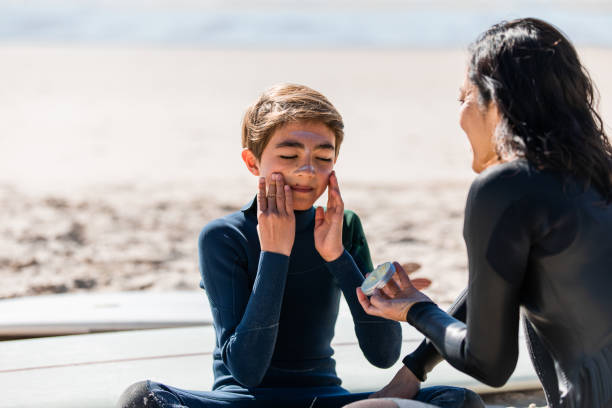 istock Aussie mums helps her son apply natural sunscreen 1335399985
