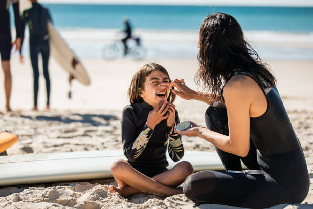 istock Aussie mums helps her daughter apply natural sunscreen 1335400764
