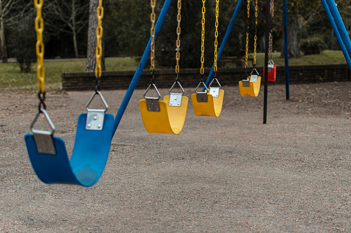 close-up, horizontal shot of colorful hammocks in a park